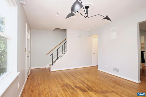 a view of entryway with wooden floor
