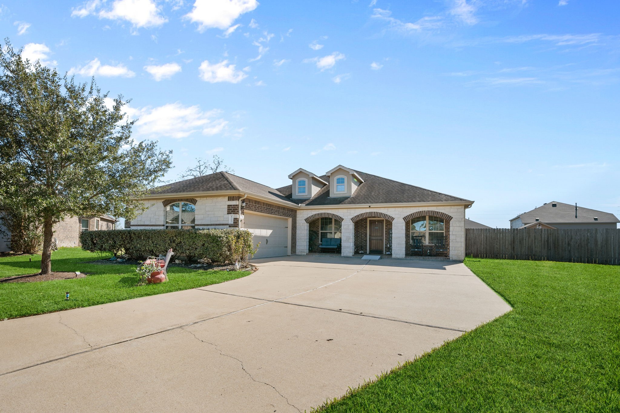 123 Noble View Court Magnolia, TX 77354 - Photo 1 of 29 a front view of a house with a yard and garage