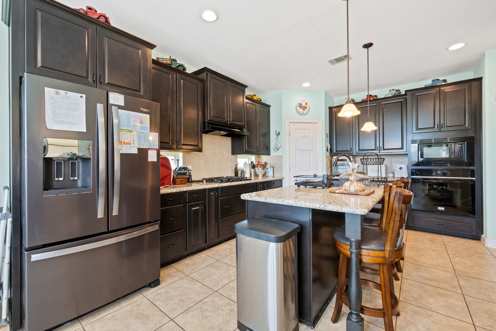 123 Noble View Court Magnolia, TX 77354 - Photo 12 of 29 a kitchen with stainless steel appliances granite countertop a refrigerator a sink a stove and a cabinets