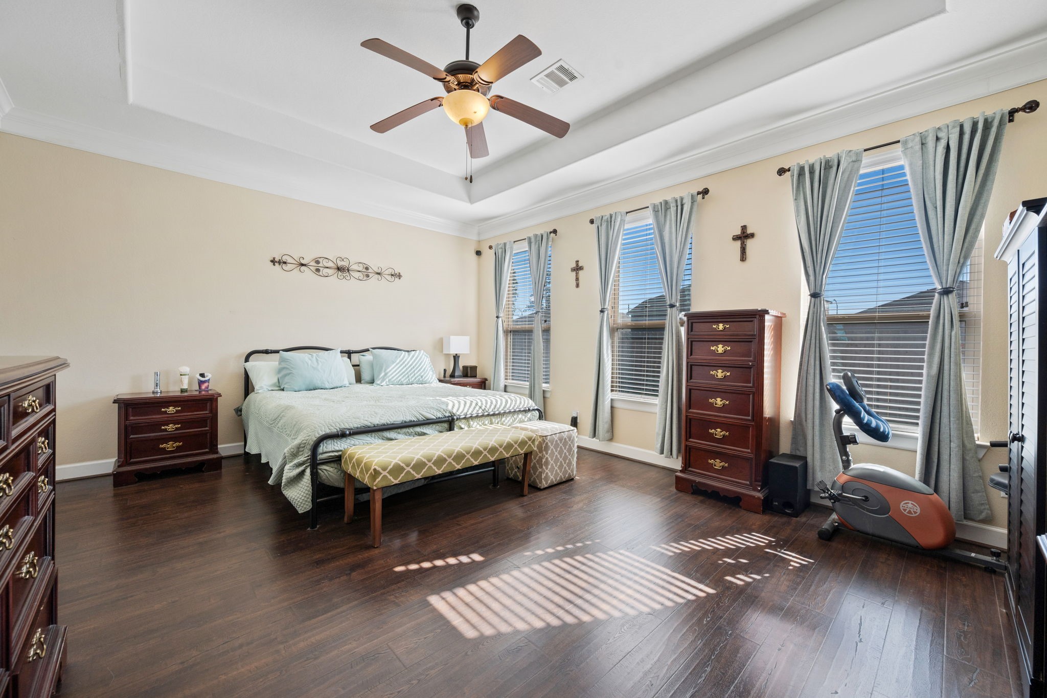 123 Noble View Court Magnolia, TX 77354 - Photo 19 of 29 a bedroom with a bed a couch and a chandelier