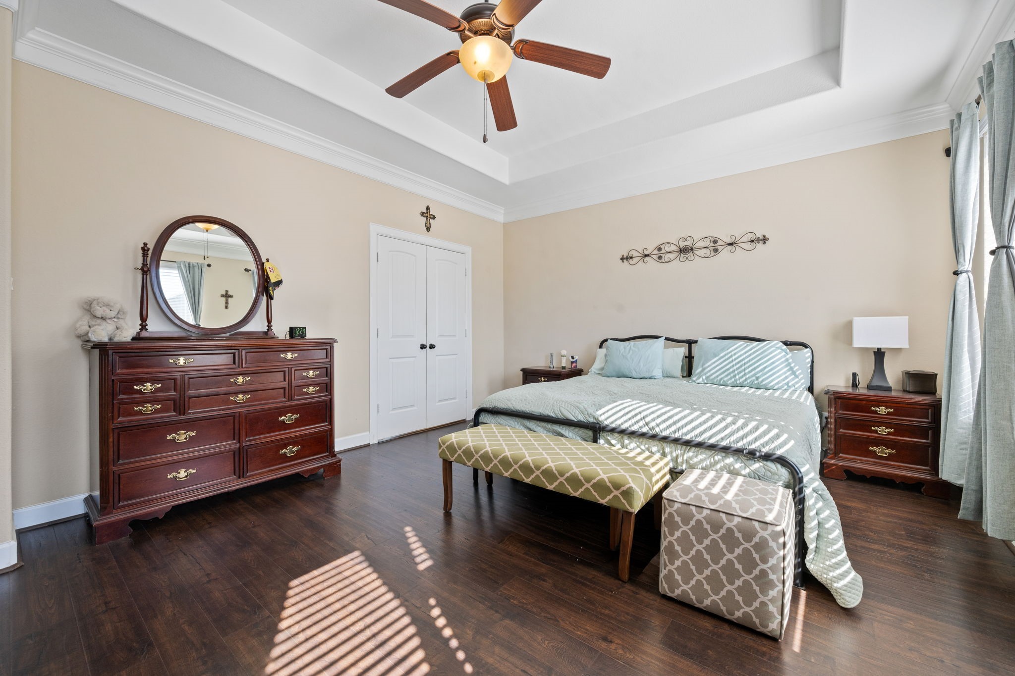 123 Noble View Court Magnolia, TX 77354 - Photo 20 of 29 a bedroom with a bed and a chandelier
