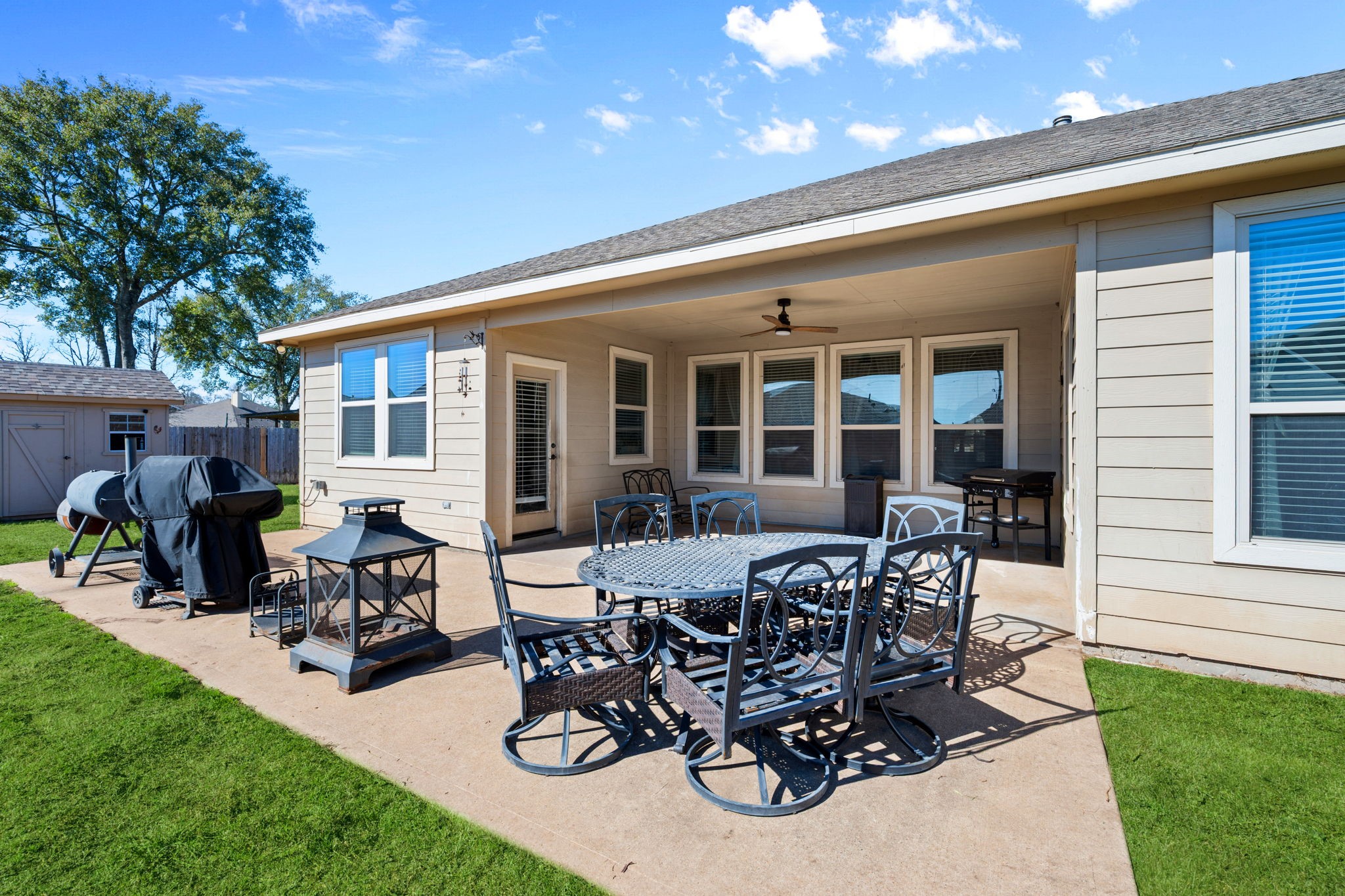 123 Noble View Court Magnolia, TX 77354 - Photo 29 of 29 a view of a patio with table and chairs potted plants and a tree