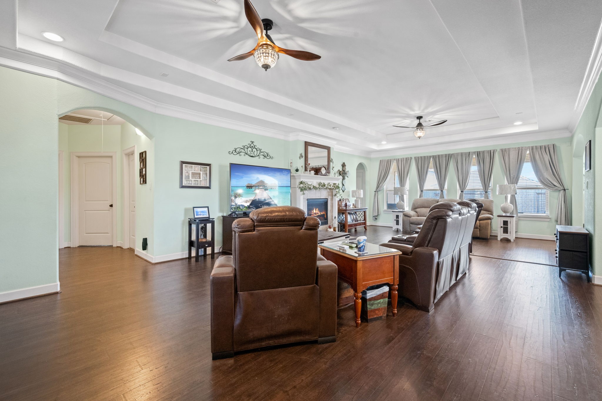 123 Noble View Court Magnolia, TX 77354 - Photo 4 of 29 a living room with furniture or chandelier and a wooden floor