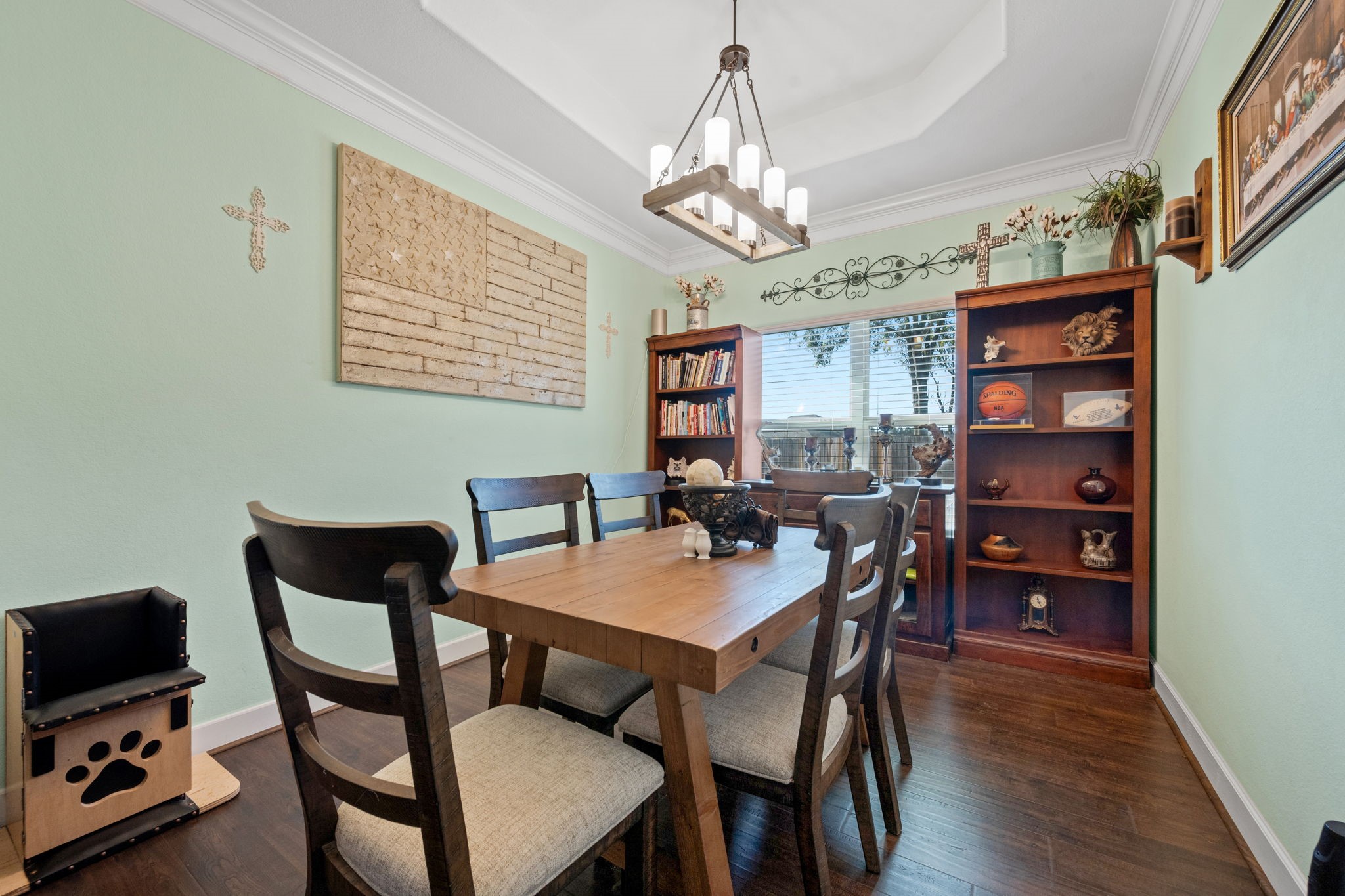 123 Noble View Court Magnolia, TX 77354 - Photo 8 of 29 a view of a dining room with furniture a chandelier and wooden floor