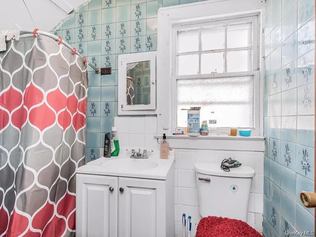 a kitchen with a sink a stove a washer and dryer
