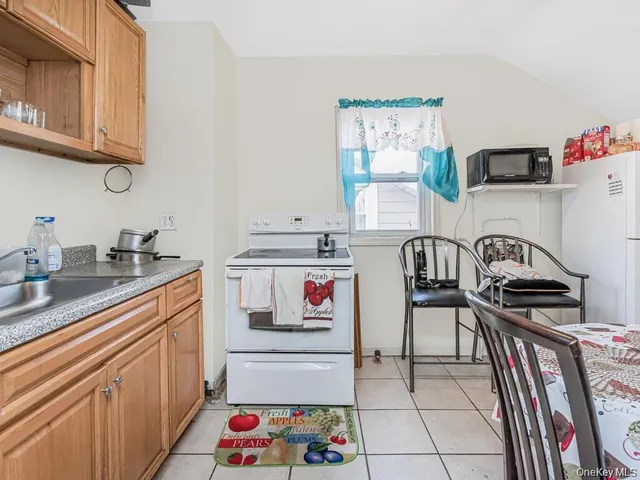 a kitchen with a sink and a stove top oven