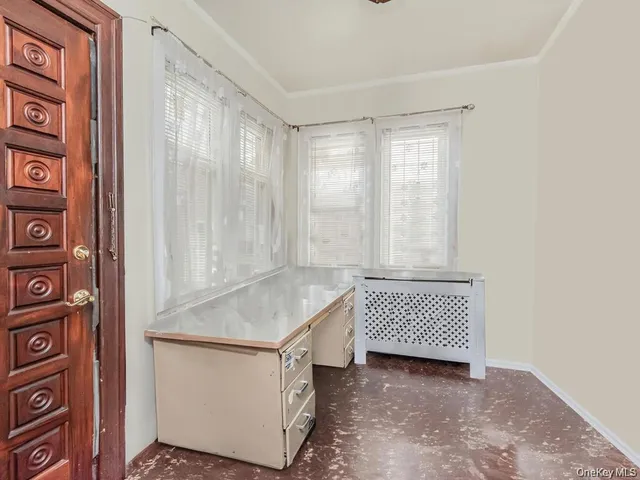 a room with a cabinet and a window