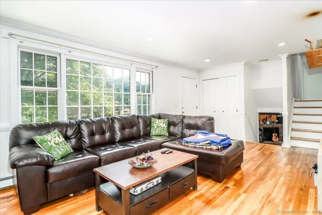 a living room with furniture and a large window