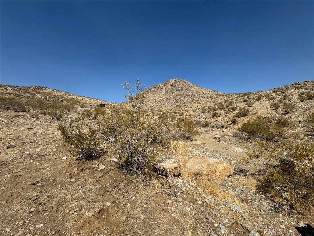 0 Plaina Road Apple Valley, CA 92307 - Photo 11 of 15 a view of a large building with mountains in the background