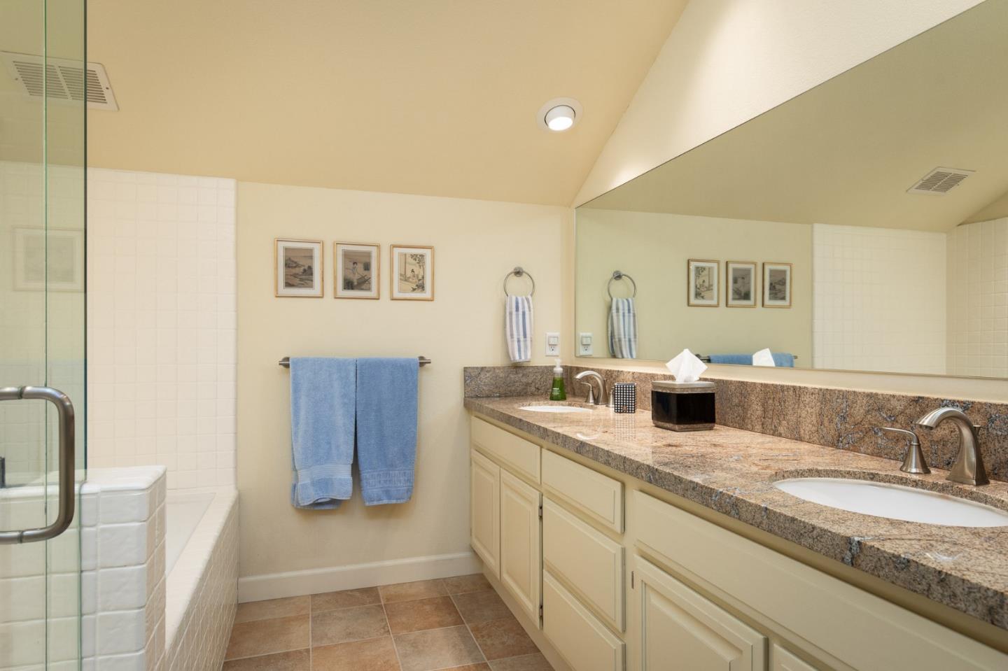 28056 Hawk Court Carmel, CA 93923 - Photo 16 of 22 a bathroom with a granite countertop sink and a mirror