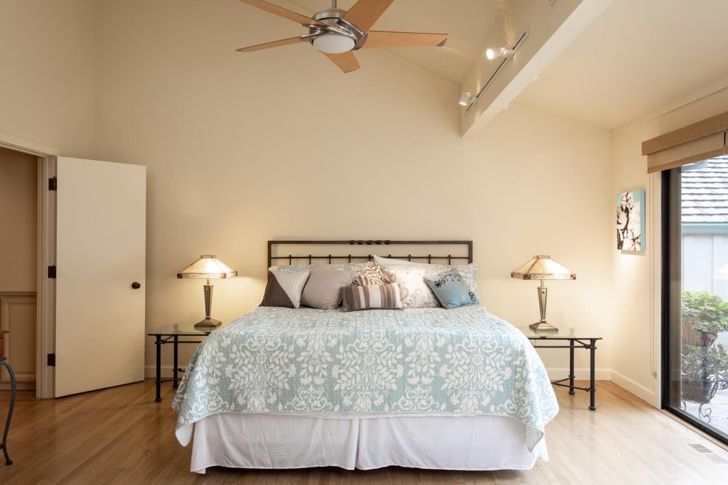 28056 Hawk Court Carmel, CA 93923 - Photo 18 of 22 a bed room with a bed and a night stand