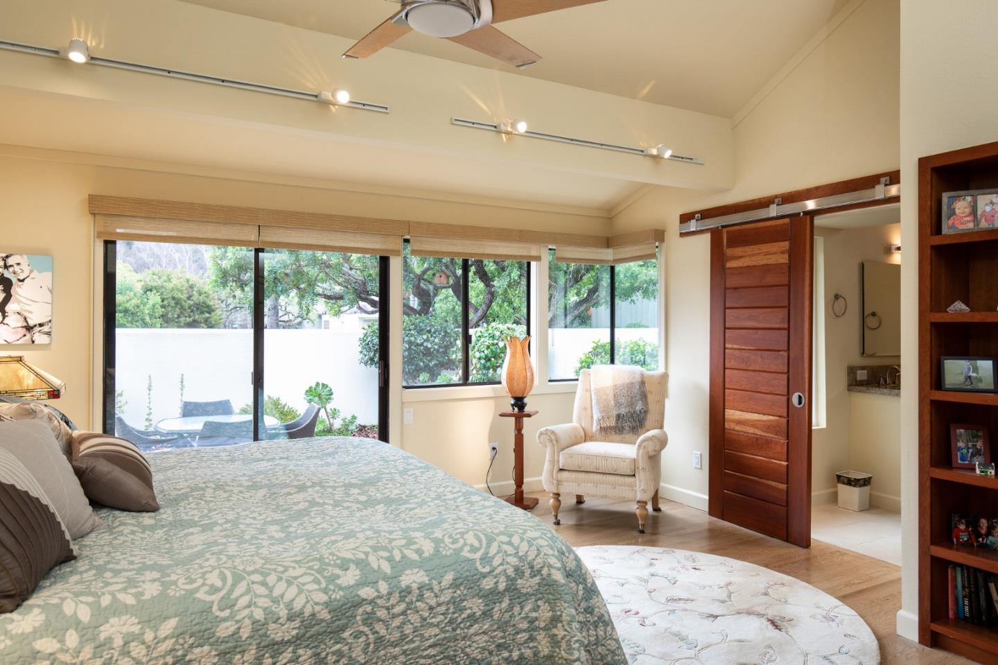 28056 Hawk Court Carmel, CA 93923 - Photo 3 of 22 a bedroom with a large bed and a large window