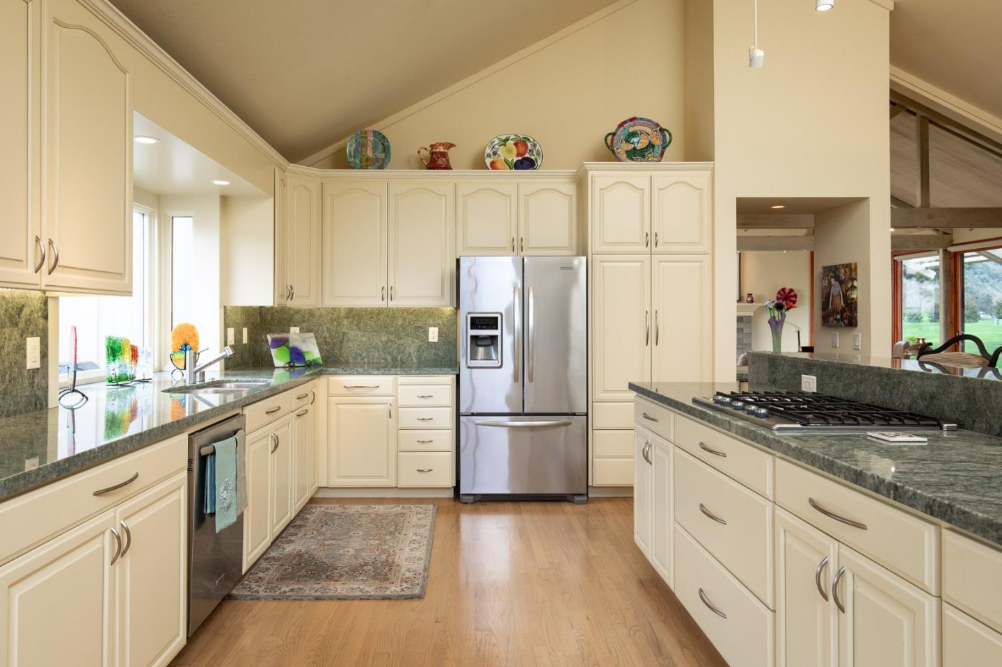 28056 Hawk Court Carmel, CA 93923 - Photo 4 of 22 a kitchen with granite countertop a refrigerator and a sink