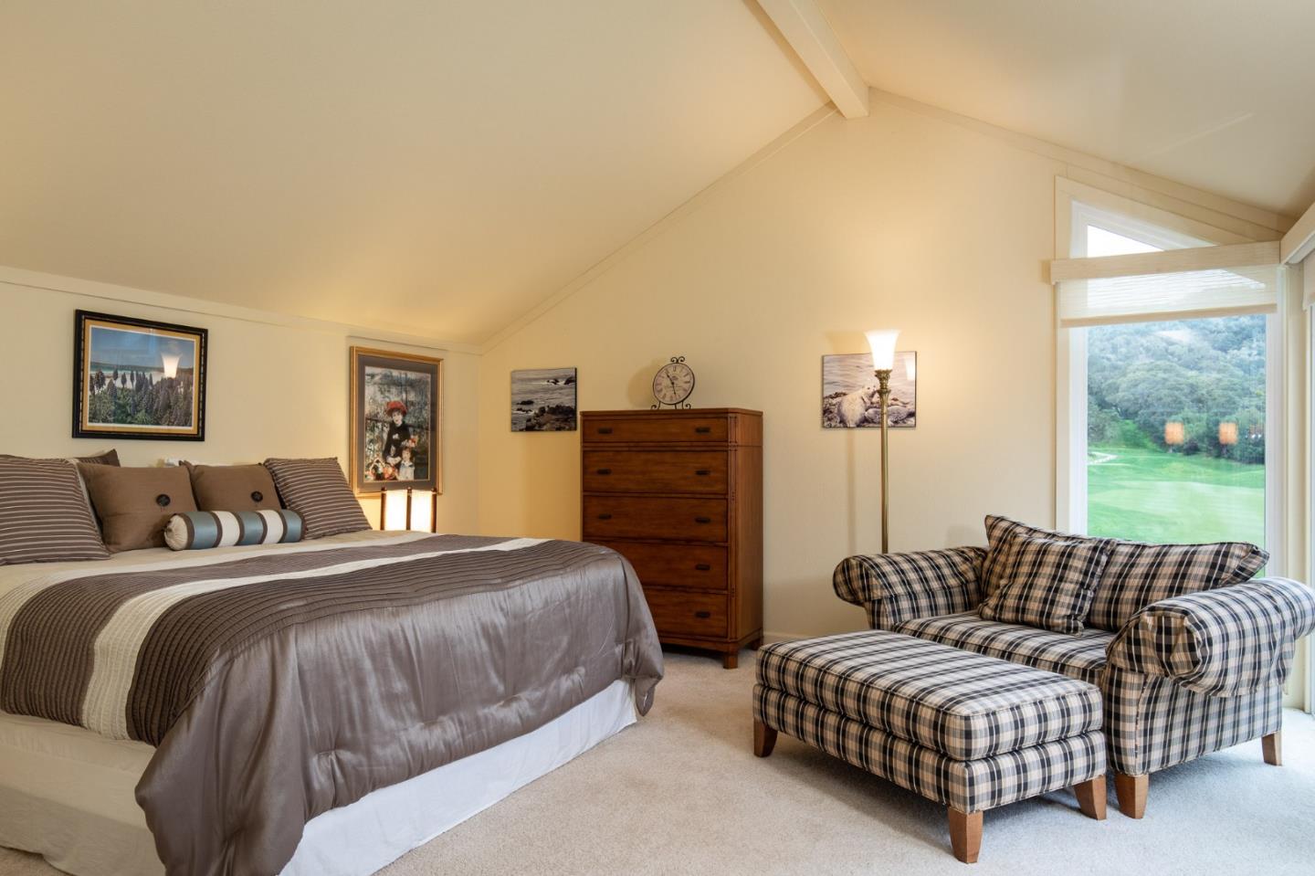 28056 Hawk Court Carmel, CA 93923 - Photo 5 of 22 a spacious bedroom with a bed a couch and a fireplace