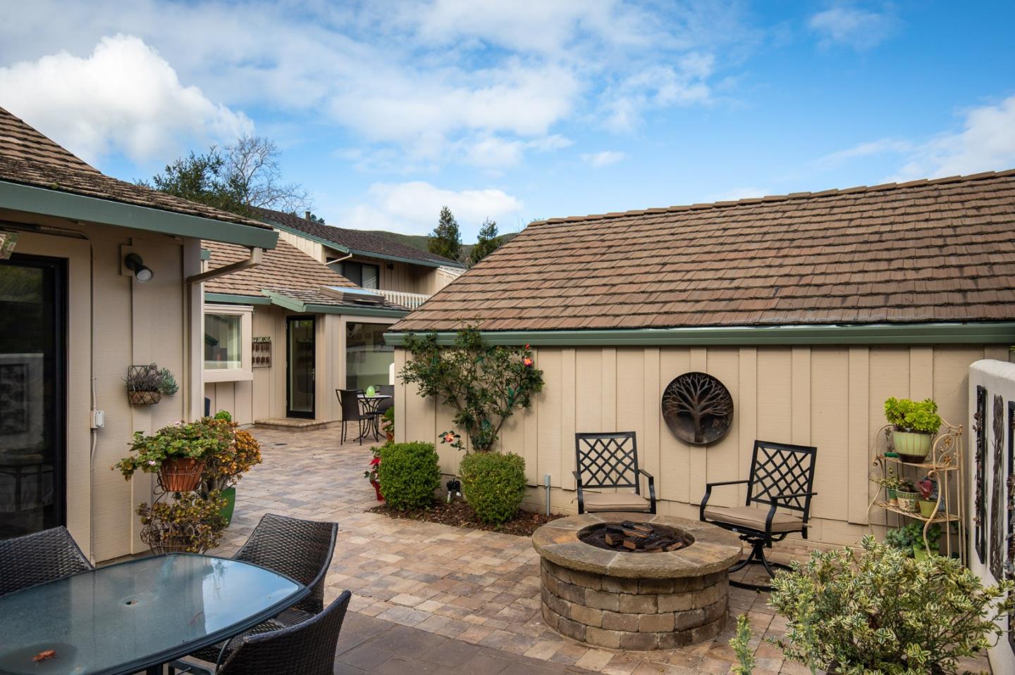 28056 Hawk Court Carmel, CA 93923 - Photo 7 of 22 a table and chairs in front of a house