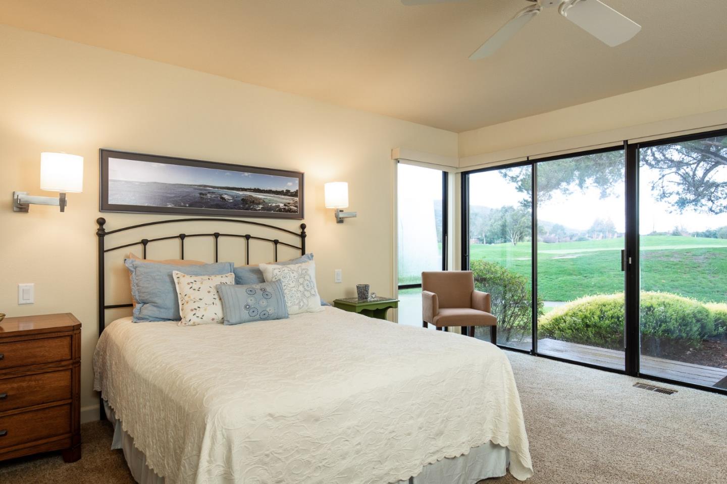 28056 Hawk Court Carmel, CA 93923 - Photo 10 of 22 a bedroom with a large bed and a balcony view