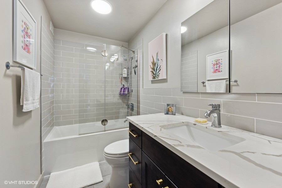 400 East Randolph Street, Unit 3429 Chicago, IL 60601 - Photo 22 of 44 a bathroom with a sink a toilet and shower