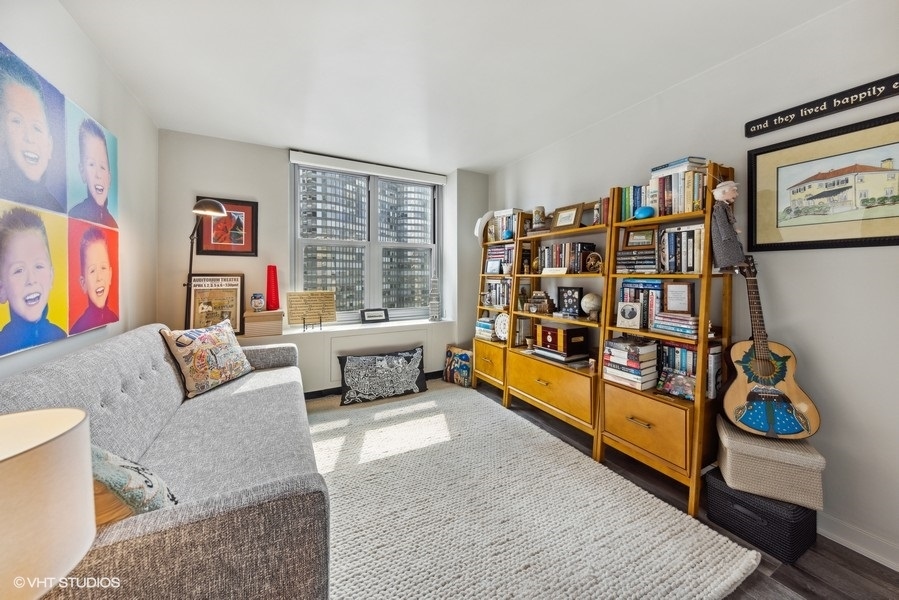 400 East Randolph Street, Unit 3429 Chicago, IL 60601 - Photo 23 of 44 a living room with furniture cabinets and window