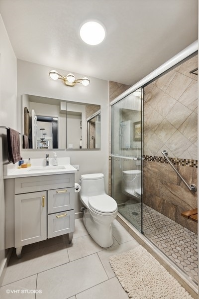 400 East Randolph Street, Unit 3429 Chicago, IL 60601 - Photo 24 of 44 a bathroom with a toilet sink and a shower