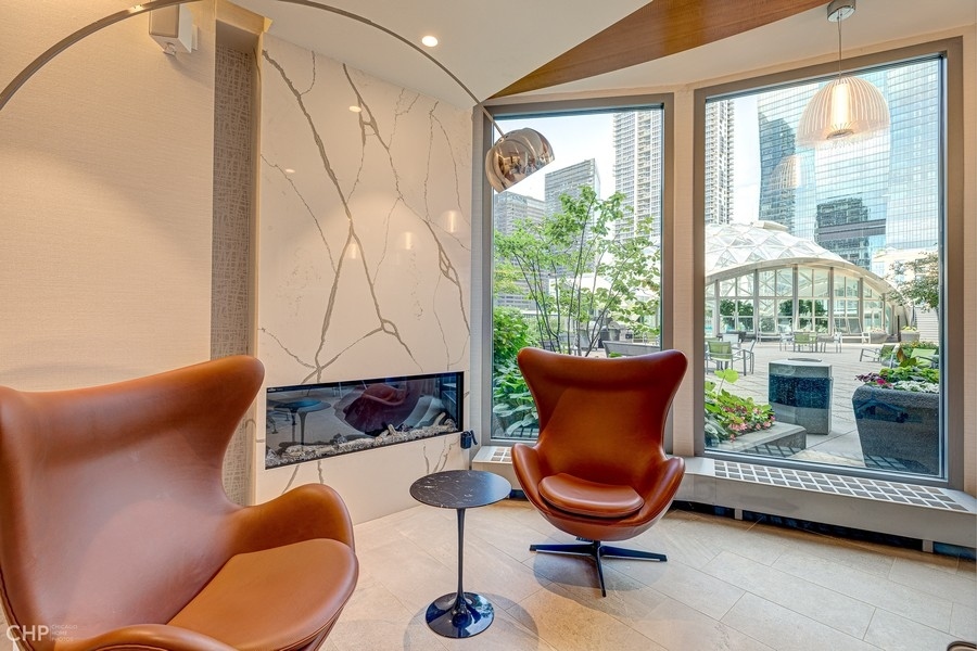 400 East Randolph Street, Unit 3429 Chicago, IL 60601 - Photo 30 of 44 a room with furniture and a potted plant