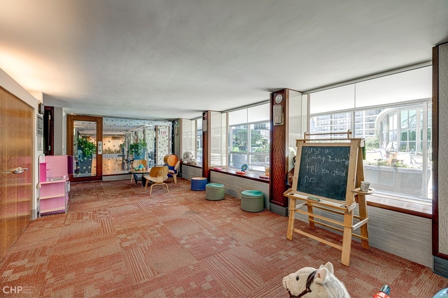 400 East Randolph Street, Unit 3429 Chicago, IL 60601 - Photo 37 of 44 a living room with furniture and a large window
