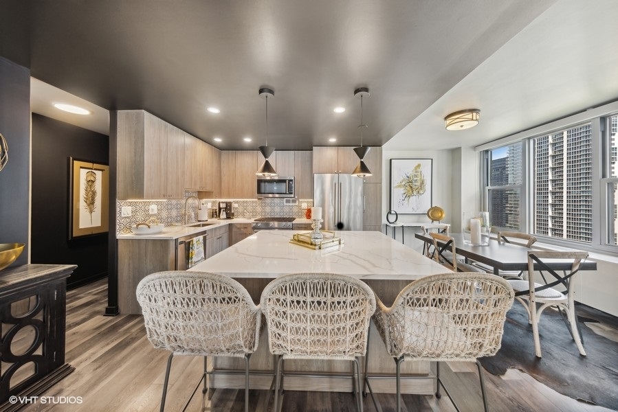 400 East Randolph Street, Unit 3429 Chicago, IL 60601 - Photo 9 of 44 a dinning room dining room and kitchen view