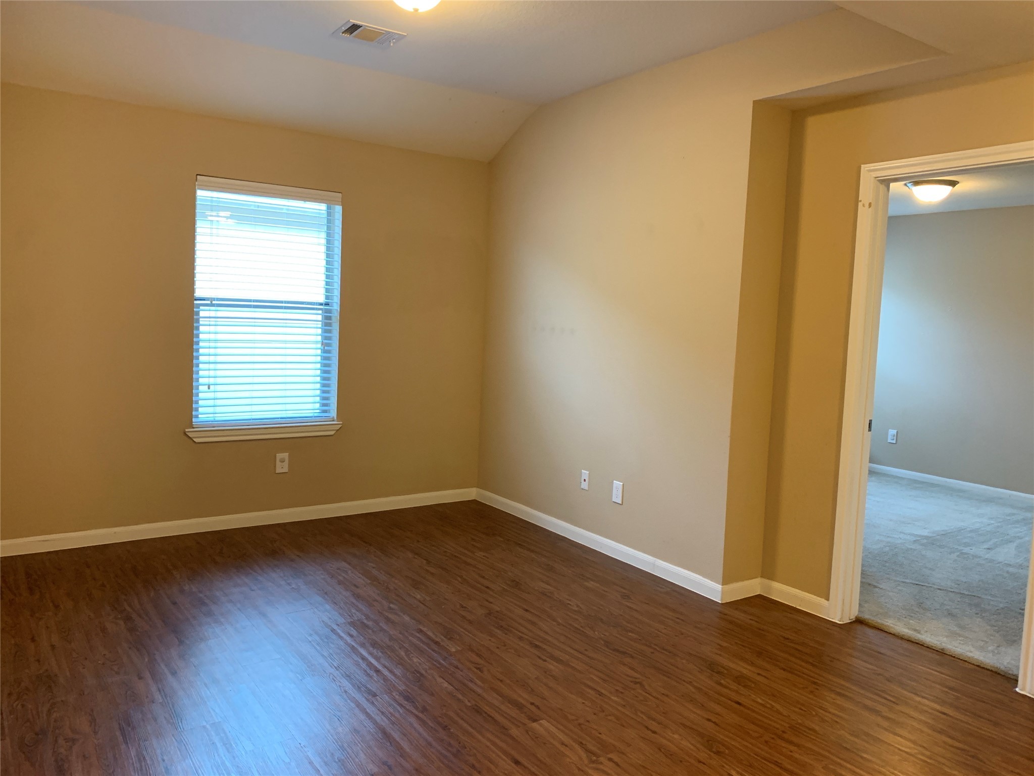 17038 Wilthorne Gardens Court Houston, TX 77084 - Photo 15 of 25 a view of an empty room with wooden floor and a window
