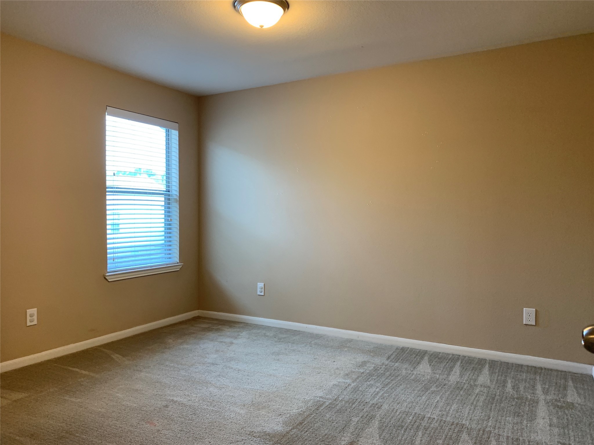 17038 Wilthorne Gardens Court Houston, TX 77084 - Photo 17 of 25 an empty room with a window