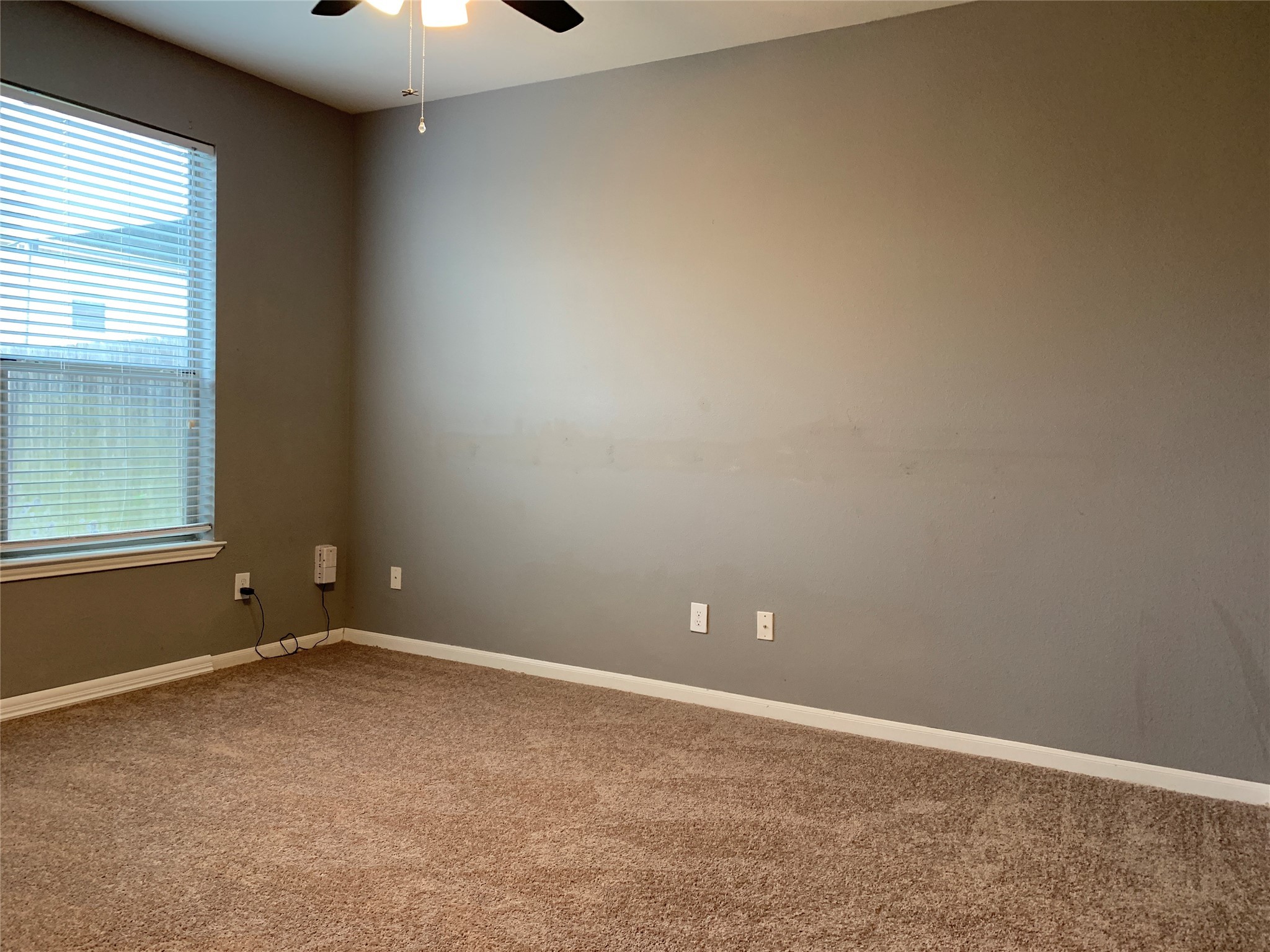 17038 Wilthorne Gardens Court Houston, TX 77084 - Photo 9 of 25 an empty room with a window