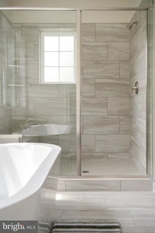 a kitchen with stainless steel appliances a sink and a refrigerator