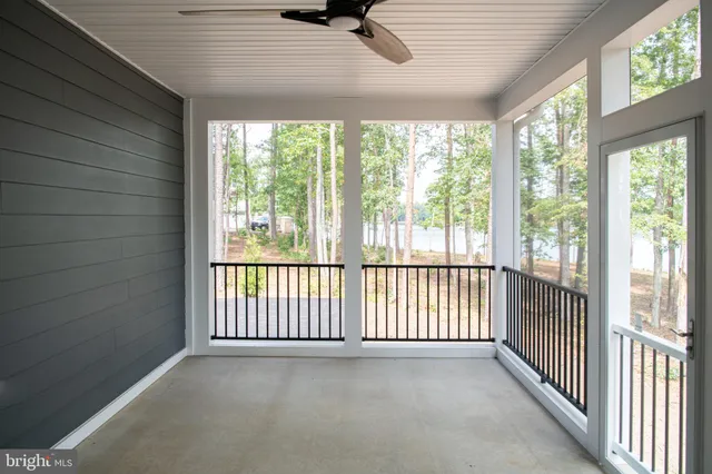 a view of a house with backyard and trees