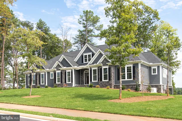 a kitchen with stainless steel appliances a sink stove and refrigerator