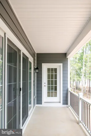 a view of house with yard and front view of a house