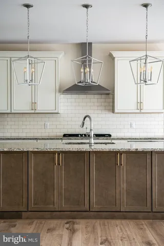 a view of a room with wooden floor and windows