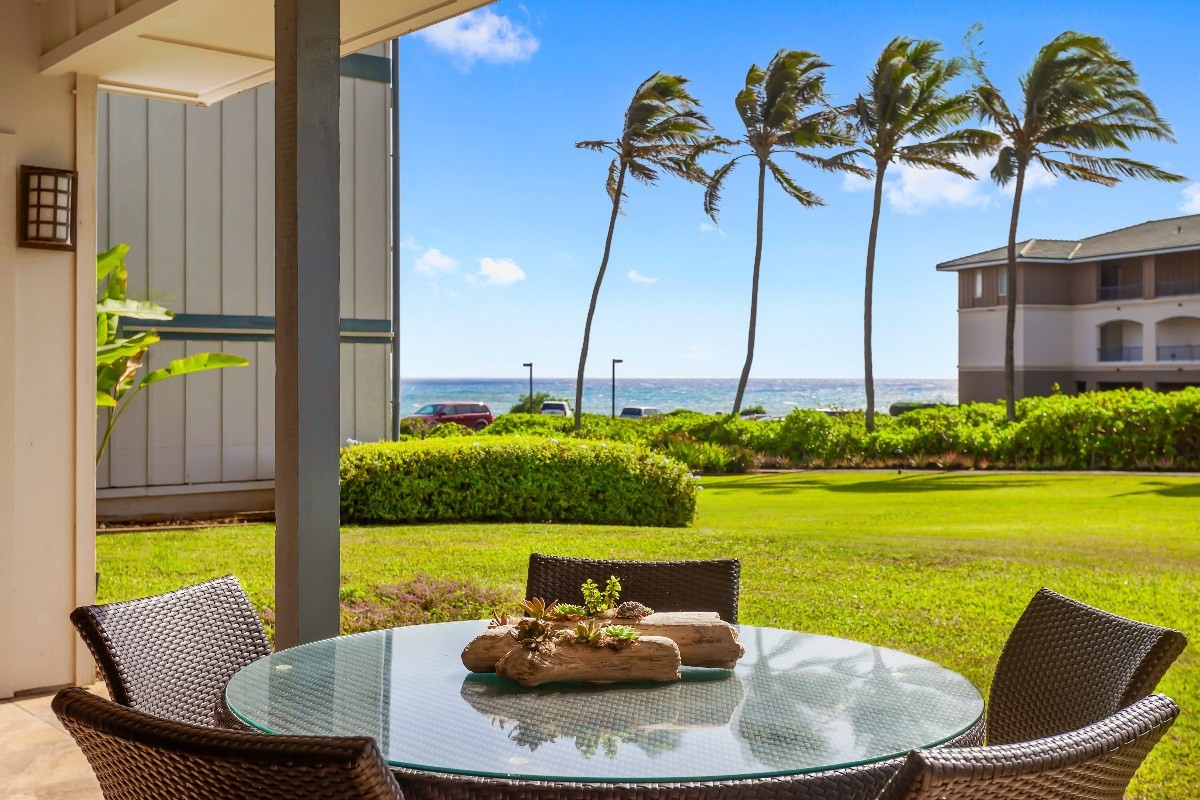 1565 Pe'e Road, Unit 415 Koloa, HI 96756 - Photo 3 of 18 a view of a swimming pool with a lounge chairs