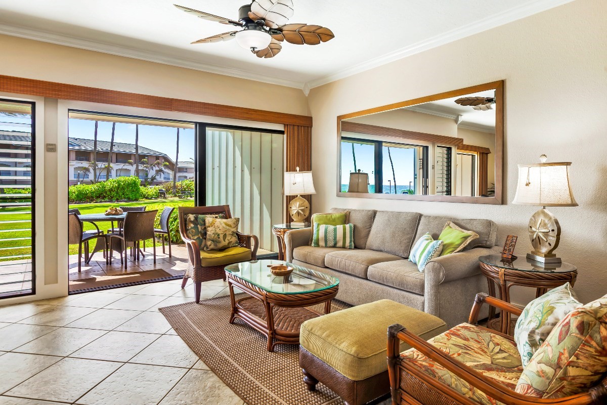 1565 Pe'e Road, Unit 415 Koloa, HI 96756 - Photo 4 of 18 a living room with furniture and a floor to ceiling window