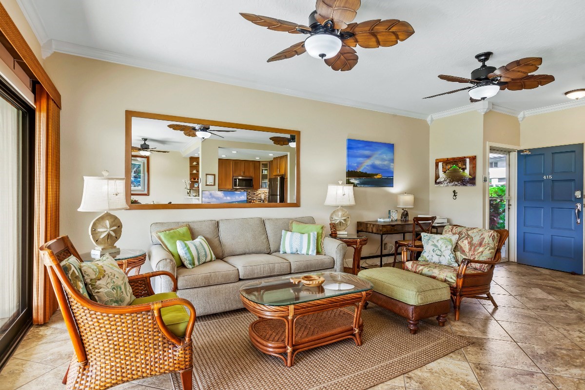 1565 Pe'e Road, Unit 415 Koloa, HI 96756 - Photo 6 of 18 a living room with furniture and a flat screen tv