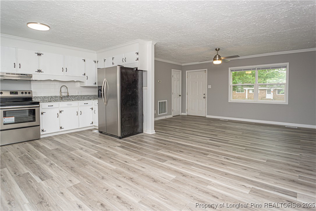 2701 Daly Avenue Spring Lake, NC 28390 - Photo 23 of 34 a view of kitchen with wooden floor