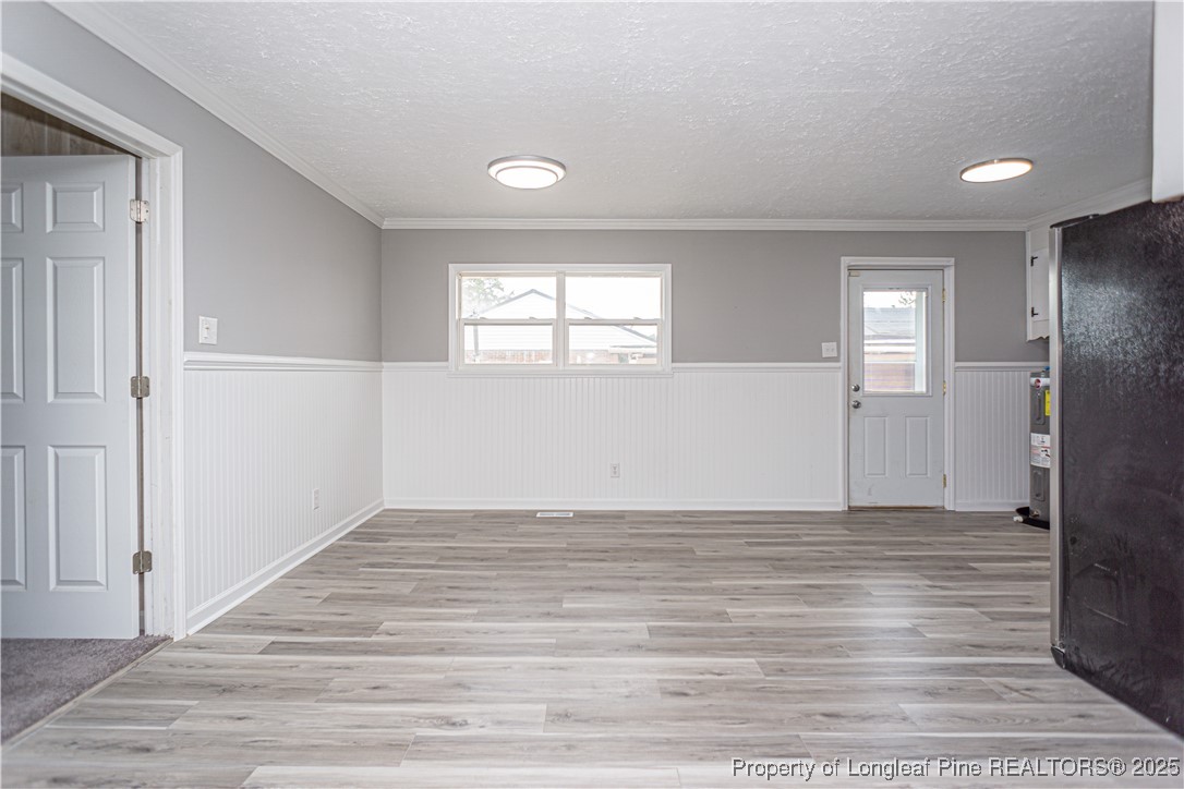 2701 Daly Avenue Spring Lake, NC 28390 - Photo 25 of 34 an empty room with wooden floor and windows