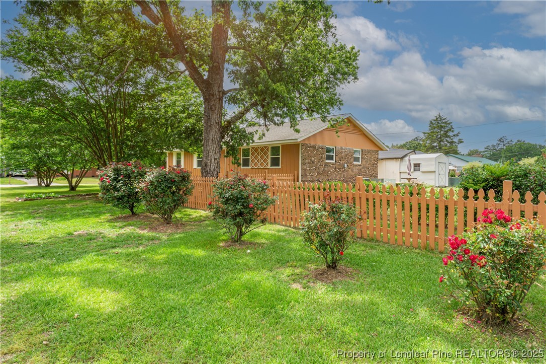 2701 Daly Avenue Spring Lake, NC 28390 - Photo 27 of 34 a front view of a house with garden