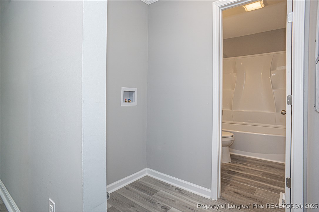 2701 Daly Avenue Spring Lake, NC 28390 - Photo 7 of 34 a view of walk in closet with empty racks