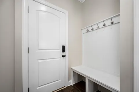 a view of a hallway with a kitchen