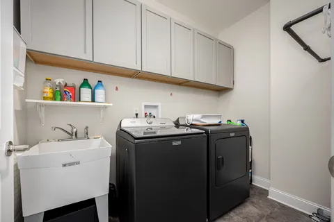 a bathroom with a double vanity sink and a mirror