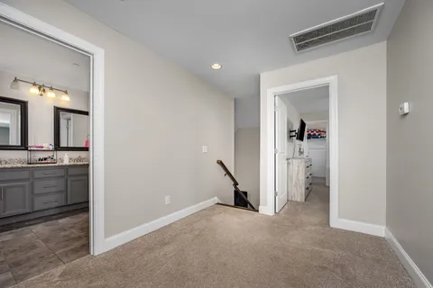 a bed room with a bed and a window