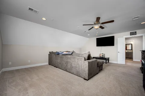 a view of a porch with furniture and garden