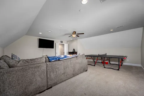 a swimming pool with outdoor seating and yard