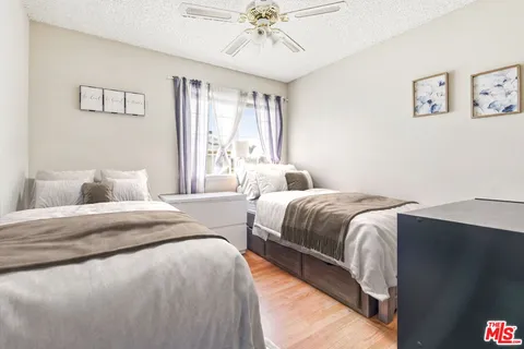 a bedroom with bed and window