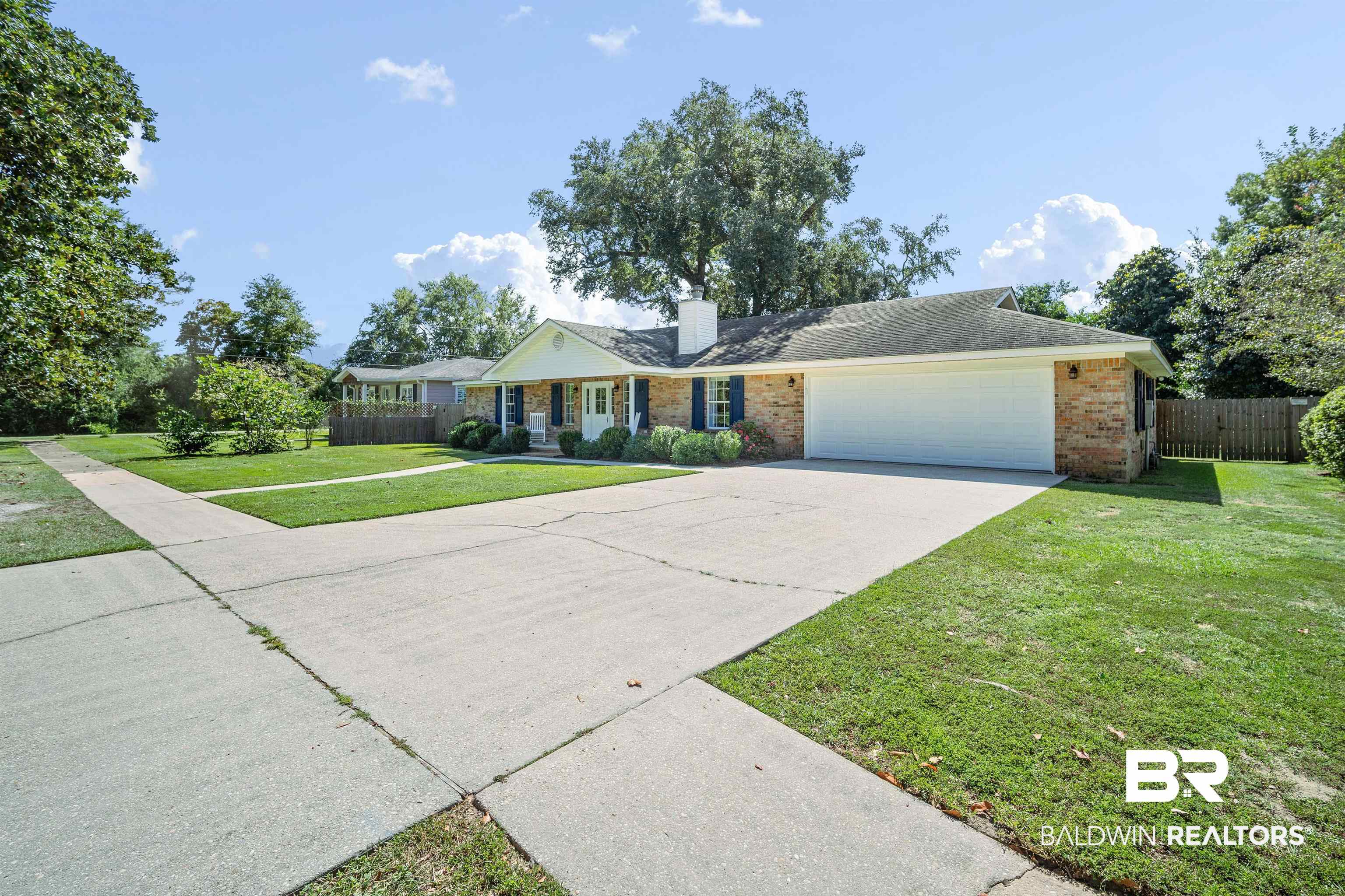 808 Michigan Avenue Fairhope, AL 36532 - Photo 2 of 33 Ranch-style house featuring a garage and a front lawn