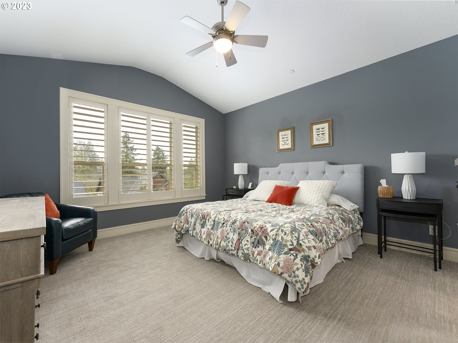 1214 Southwest Ophelia Street Portland, OR 97219 - Photo 16 of 36 a bed room with a bed and a couch