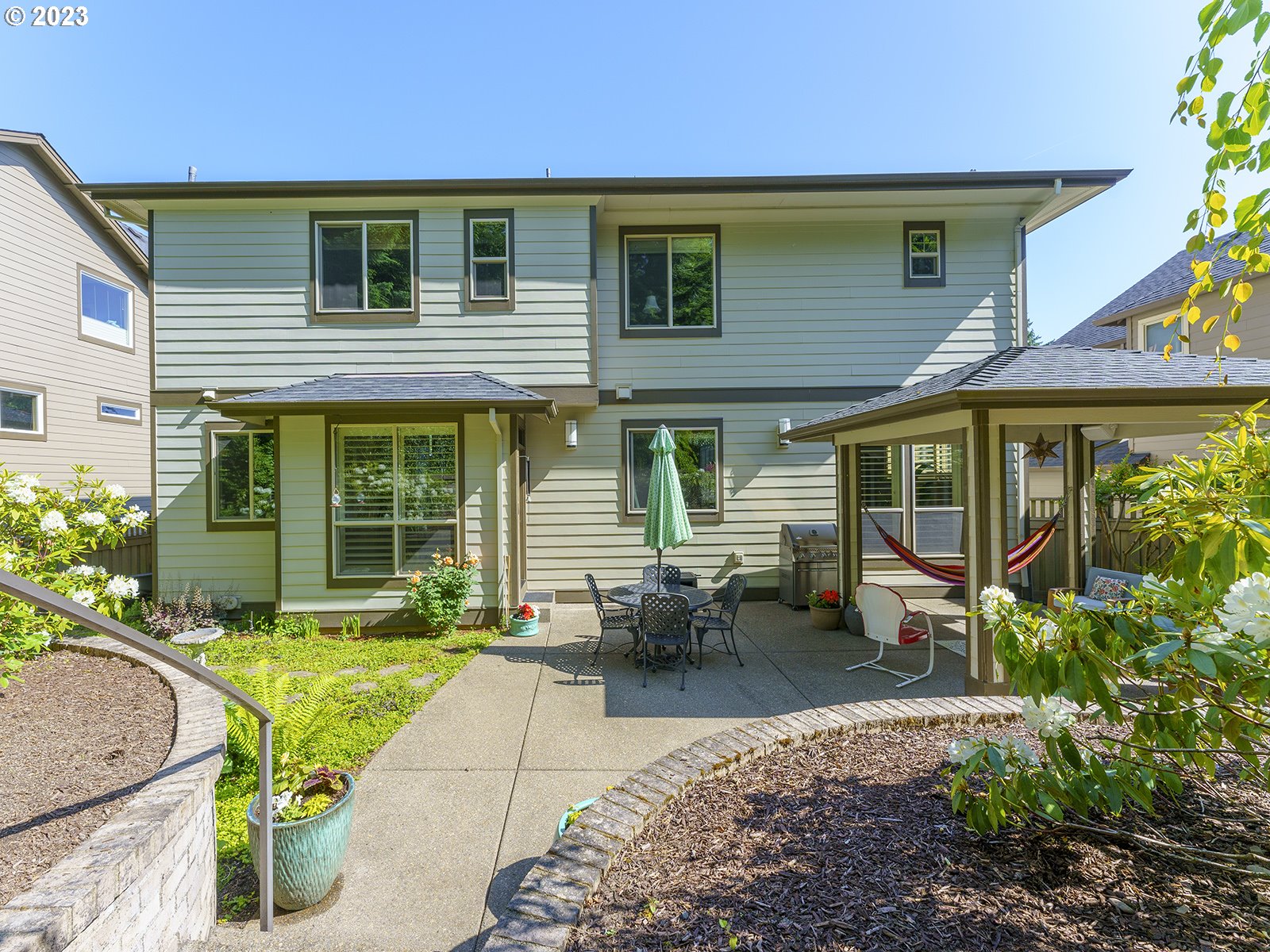 1214 Southwest Ophelia Street Portland, OR 97219 - Photo 35 of 36 a view of a house with a patio